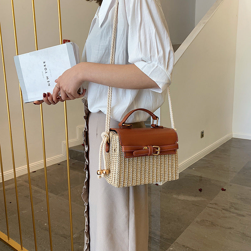 Fashion Box Rattan Women Handbags Wicker showcased on a woman holding a shopping bag in an elegant setting.