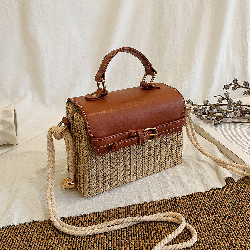 Fashion Box Rattan Women Handbags Wicker in brown and woven design with rope strap on a textured background.