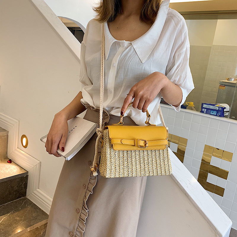 Fashion Box Rattan Women Handbags Wicker in yellow, carried by a woman wearing a white blouse and skirt.