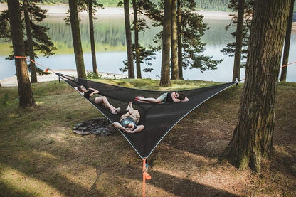 Multi-Person Hammock Three Point Design Portable Hammock Multi-functional Triangle Aerial Mat with three people relaxing outdoors.