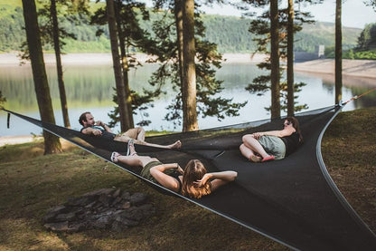 Multi-Person Hammock Three Point Design Portable Hammock Multi-functional Triangle Aerial Mat in use by three adults outdoors.