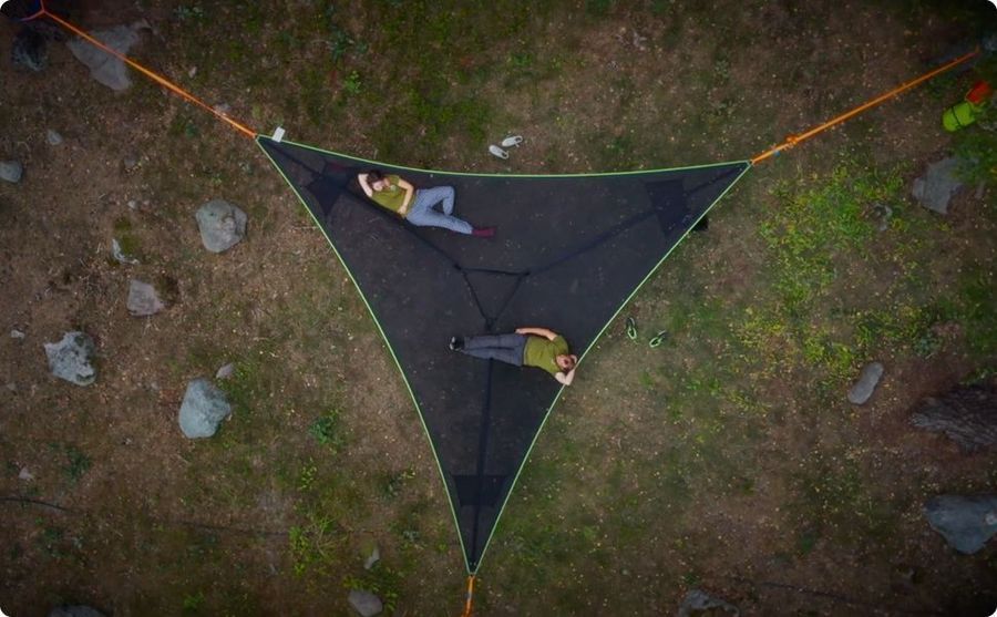 Multi-Person Hammock Three Point Design Portable Hammock Multi-functional Triangle Aerial Mat in use with two people relaxing.