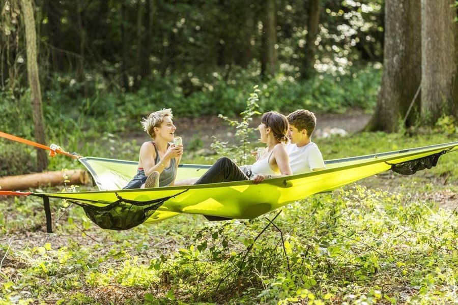 Multi-Person Hammock Three Point Design Portable Hammock Multi-functional Triangle Aerial Mat used in nature by three people.