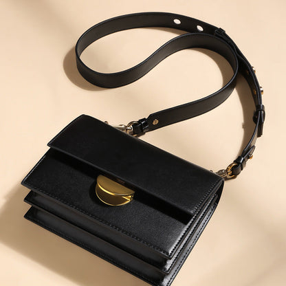 Crossbody bag with studded strap