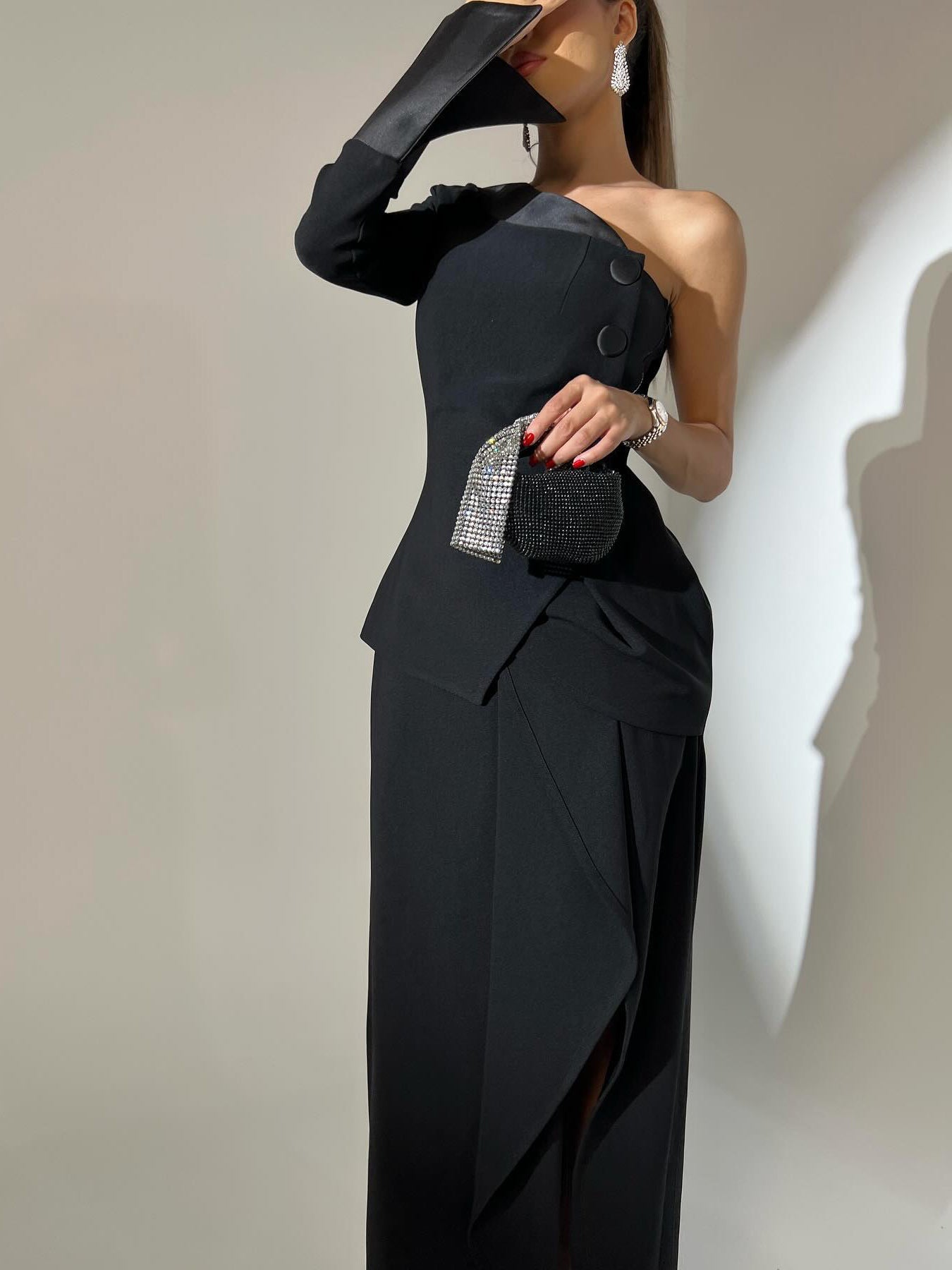 One-piece Single-breasted Top & Irregular Skirt Set worn by a model with a stylish peplum design and an asymmetrical skirt.