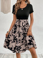 Casual Printing Lace-up Women's Dress featuring a floral A-line skirt with a black top and elegant shoulder strap.