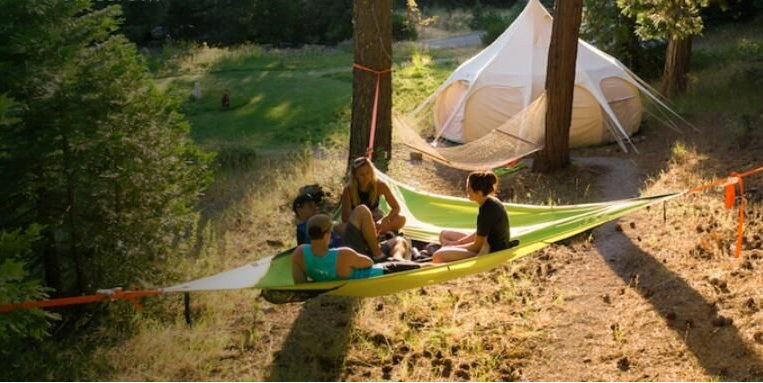 Multi-Person Hammock Three Point Design Portable Hammock Multi-functional Triangle Aerial Mat setup in a scenic outdoor location.