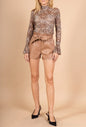 High-waisted faux leather shorts with tied belt