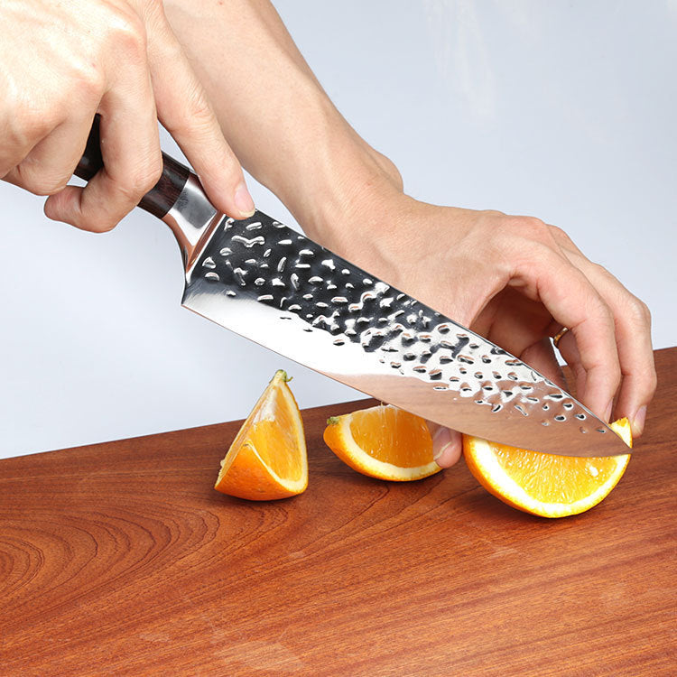 Kitchen Knife Professional Japanese Chef Knives slicing an orange on wooden cutting board
